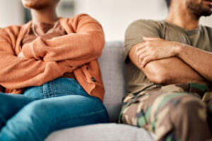 Fight, argument and couple on sofa in therapy for conflict, marriage problem and divorce counseling.