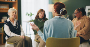 Group therapy, counseling and women with therapist for support