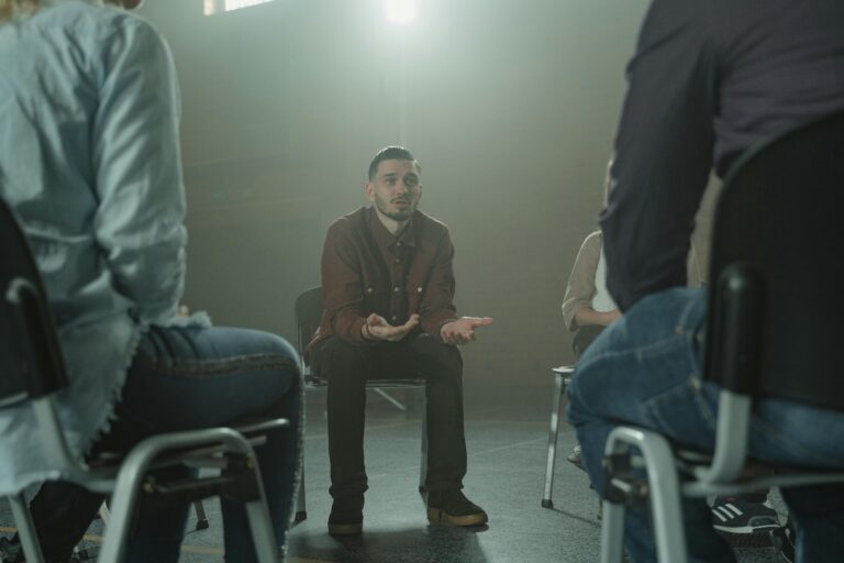 A man in an addiction group session.