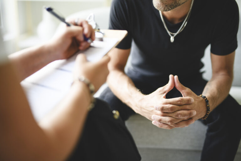Man with psychologist theraphy social problems concept drug addiction talk to a psychological woman